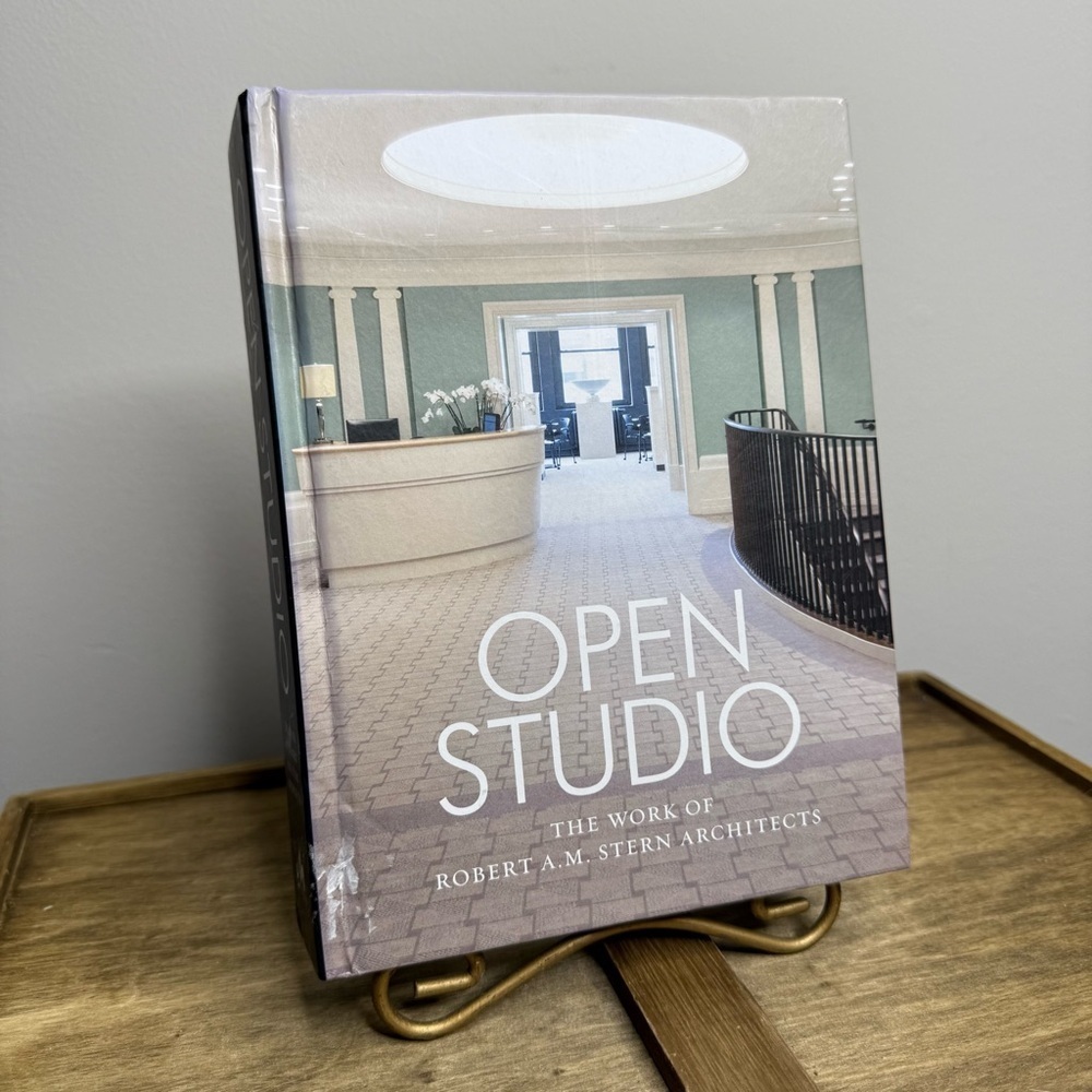 hardcover book titled Open Studio: The Work of Robert A.M. Stern Architects